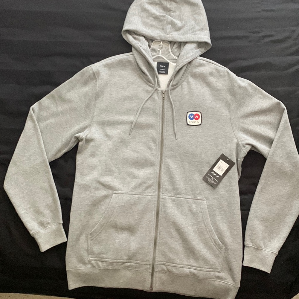 Brand new RVCA grey zip up hoodie. It is to snug/small on me. Offers considered